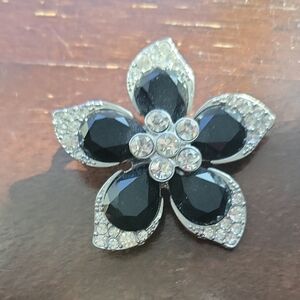Elegant Black Crystal Flower Brooch with Clear Accents